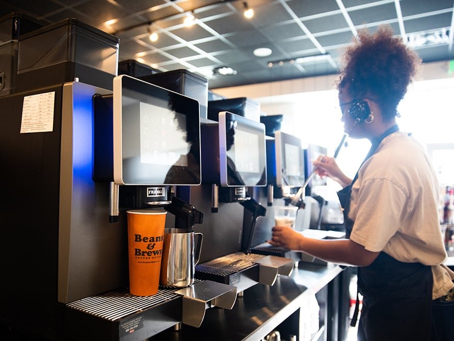 Beans & Brews employee preparing drink