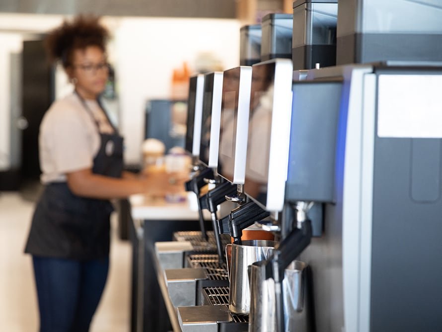 Beans & Brews employee preparing drink
