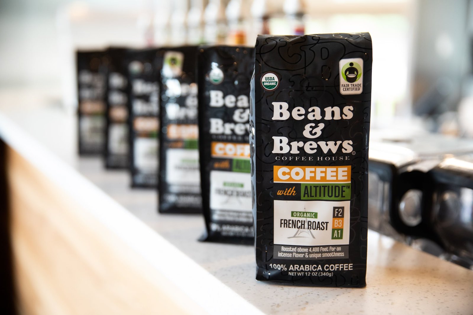 Bags of coffee displaying logos and brand colors